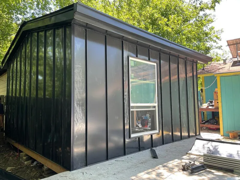 Black standing seam metal wall panels for Metal Roof Installation in Scottsboro